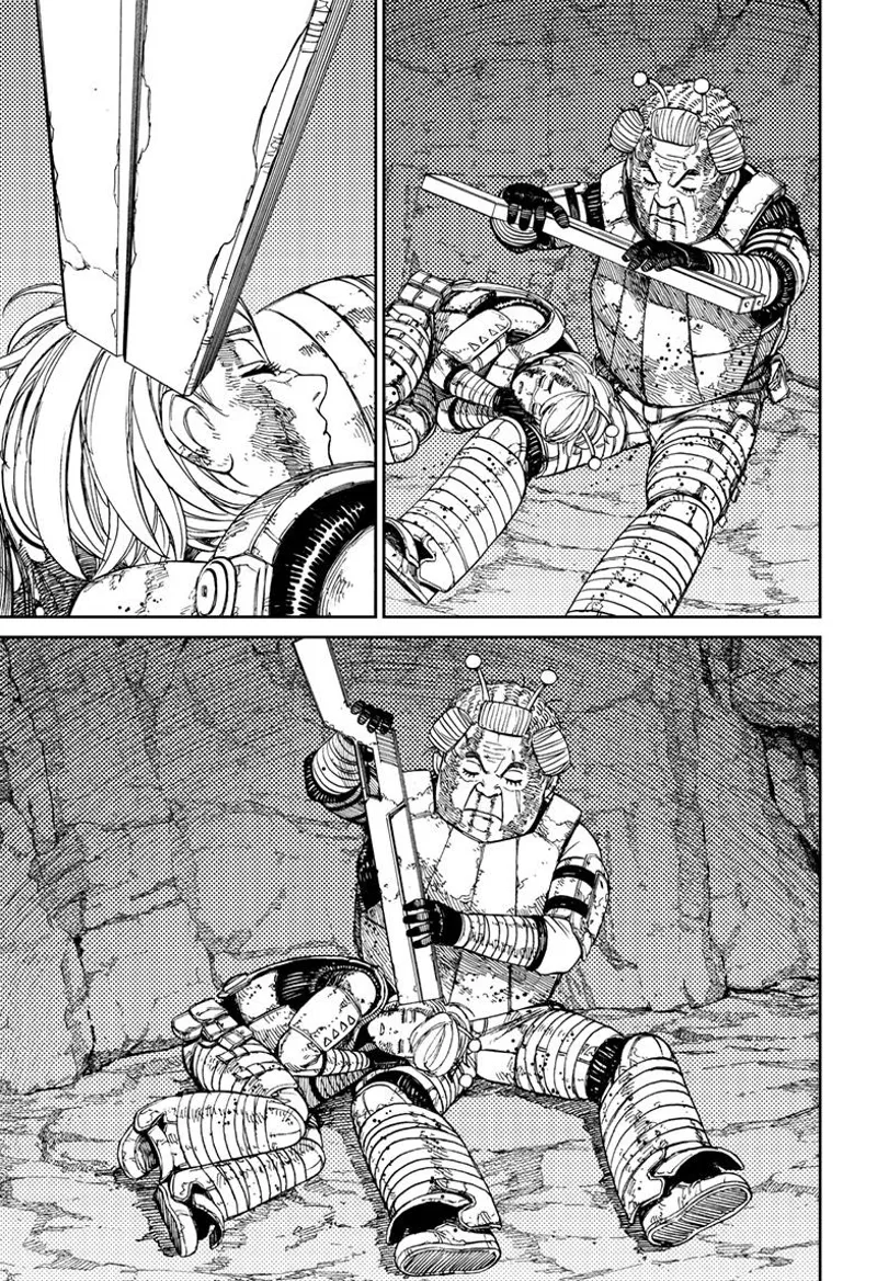Ms. Banga points her gun at Vamola's head.