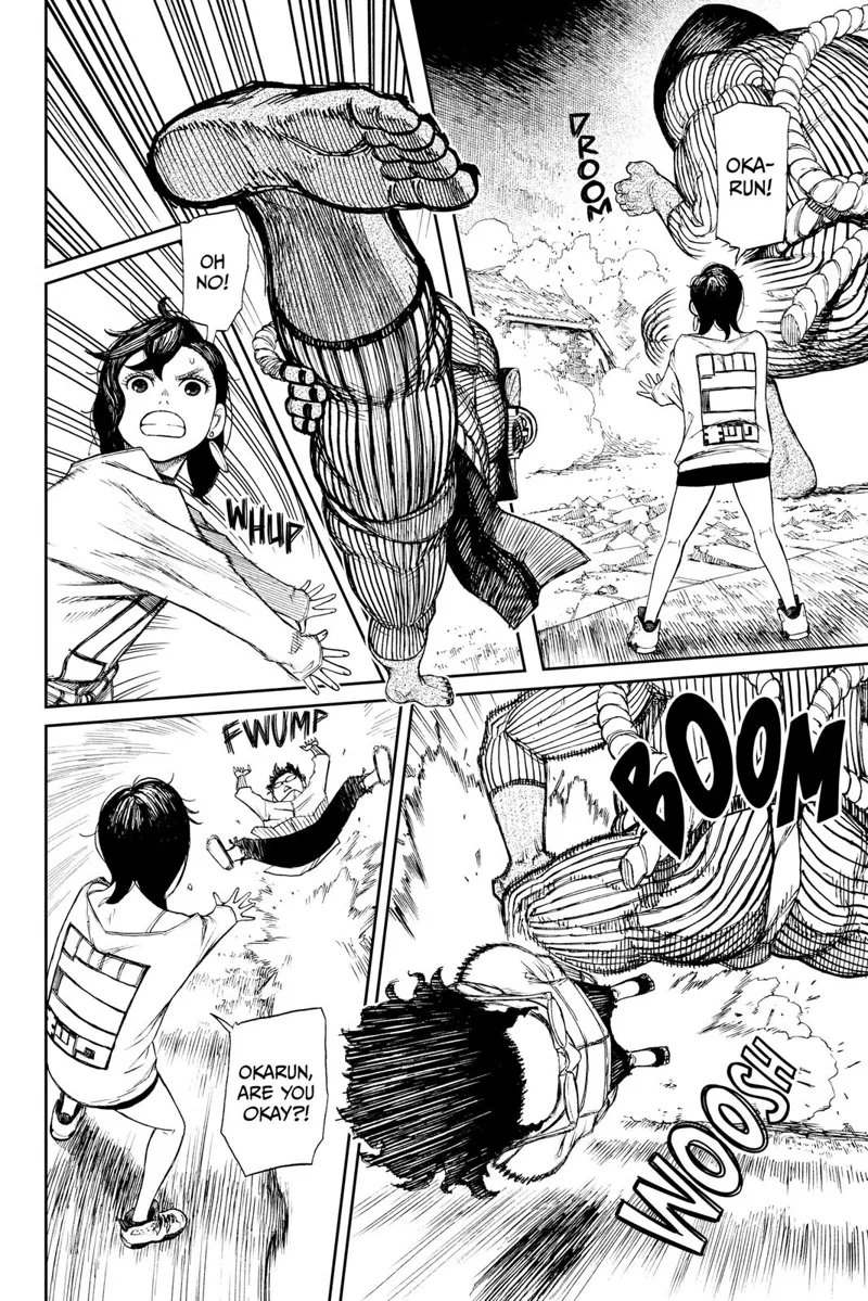 The alien stomps and Ayase pulls the cursed Okarun, who is now back in human form and using his powers.